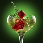 red dices inside a cocktail glass