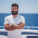 dan bilzerian on a yacht in white t-shirt