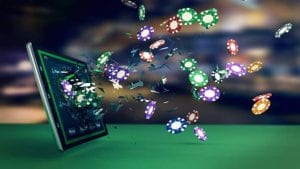poker chips coming out of a computer screen
