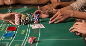baccarat table with chips and cards
